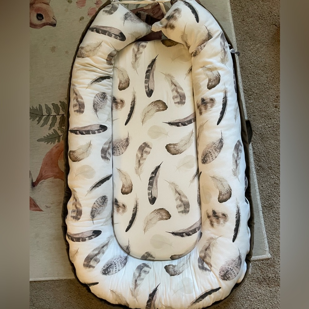 Boppy nursing pillow and baby lounger both with removable covers